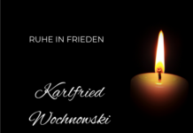Kerze vor dunklem Hintergrund
